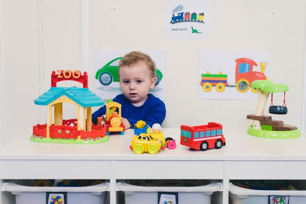 Child exploring toys during nursery play
